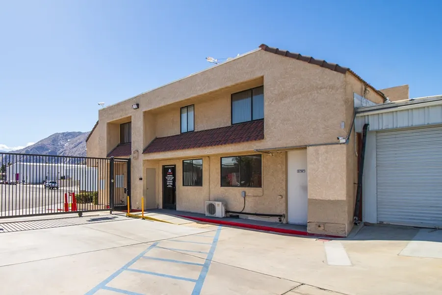 Storage facility office building with gated access and parking area